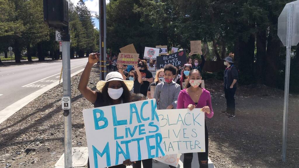 Jackie Elward leads protesters in Rohnert Park in support of the Black Lives Matter movement on Saturday, June 13, 2020. (Kent Porter/The Press Democrat)