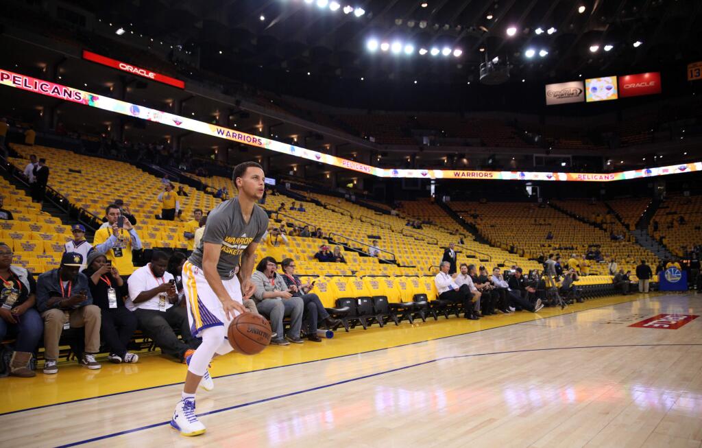 Golden State Warriors guard Stephen Curry warms up prior to Game 2 of the first round of the NBA Western Conference playoffs at Oracle Arena, in Oakland on Monday, April 20, 2015. (Christopher Chung/ The Press Democrat)