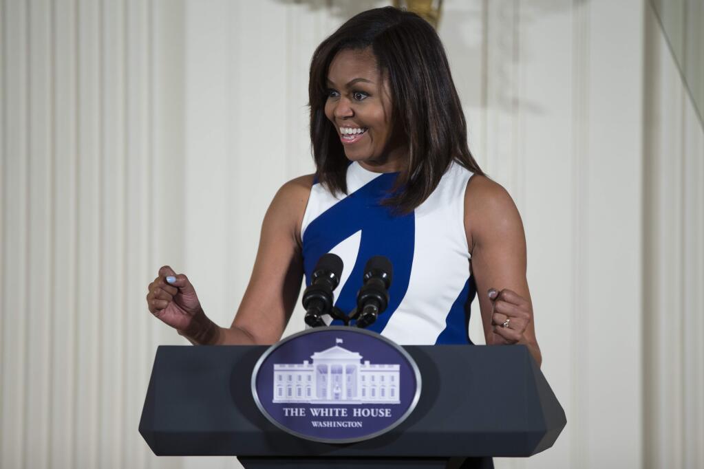 FILE- In this June 1, 2016 file photo, first lady Michelle Obama speaks in the East Room of the White House in Washington. Michelle Obama's 'Carpool Karaoke' joyride with James Corden will air Wednesday, July 20, on the late-night host's CBS show. The first lady and Corden sing 'This Is For My Girls,' described as a 'girl power anthem' intended to promote full access to education worldwide. (AP Photo/Evan Vucci, File)