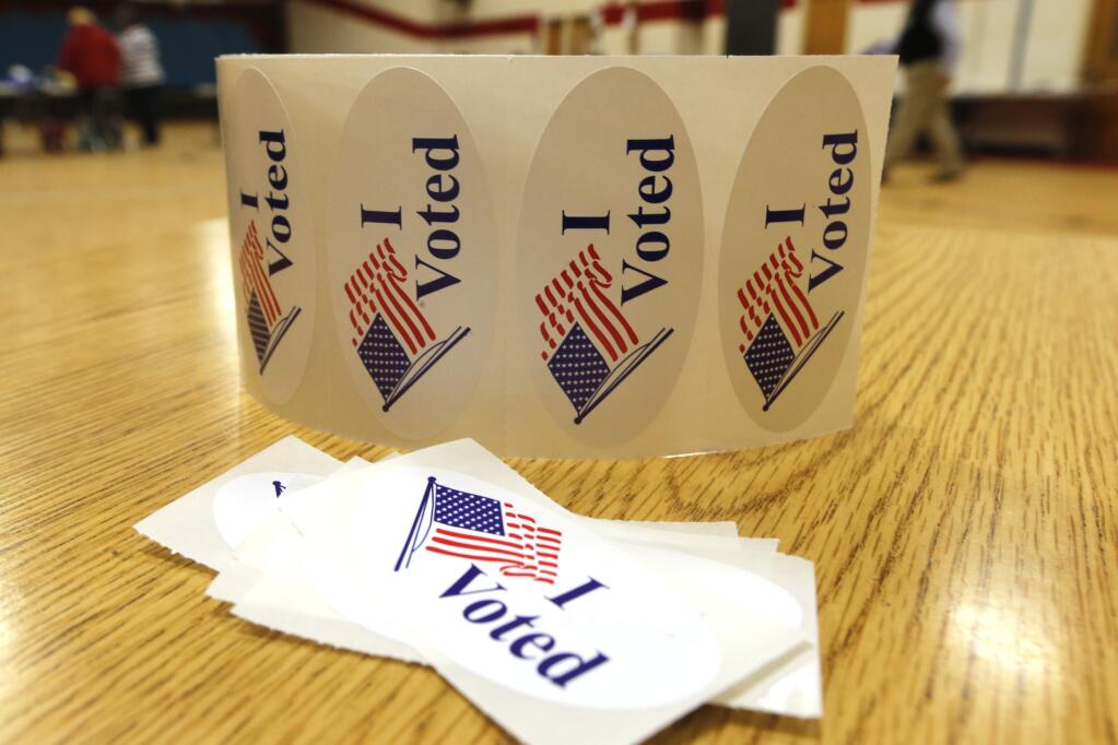 If you’ve recently been displaced in a Sonoma County wildfire, here’s what to know about voting in the upcoming election. (AP Photo/Steve Helber)