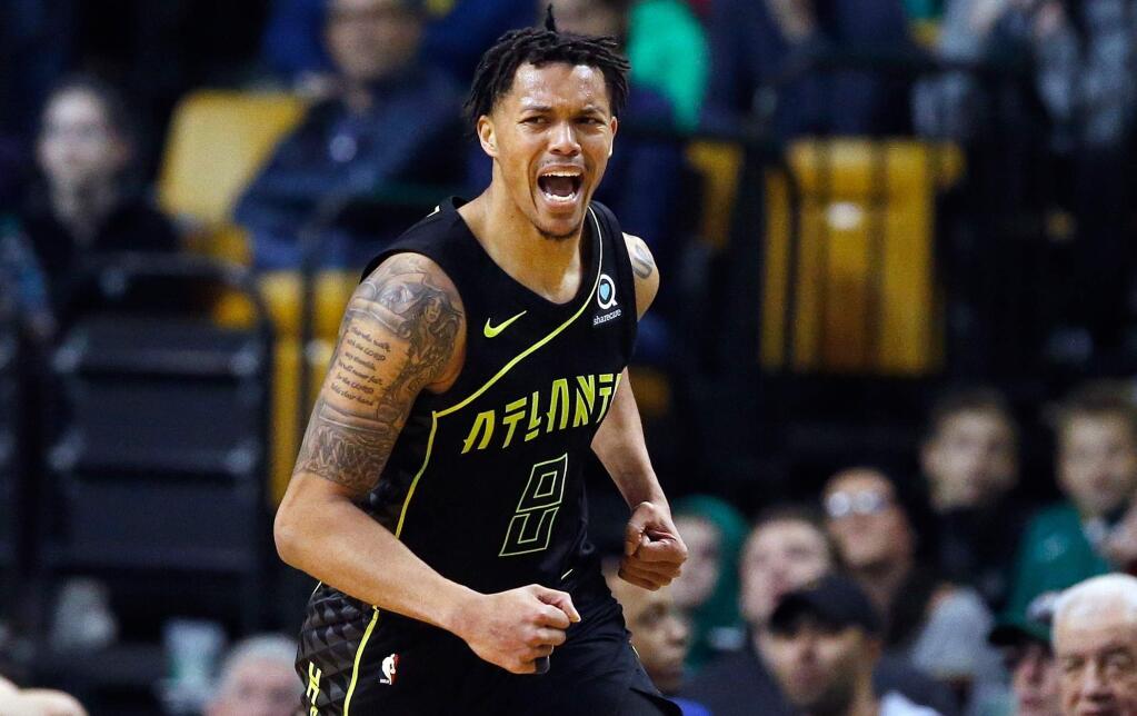The Atlanta Hawks' Damion Lee reacts after scoring during the fourth quarter against the Boston Celtics in Boston, Sunday, April 8, 2018. The Hawks won 112-106. (AP Photo/Michael Dwyer)