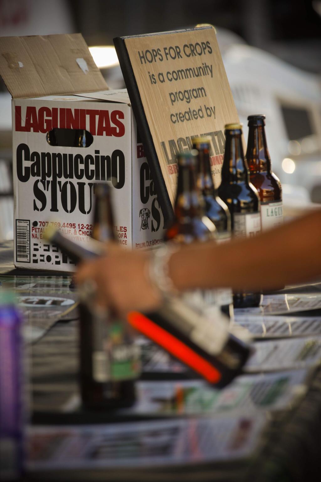 Lagunitas Brewery sells their beer at the Wednesday night farmer's market in downtown Petaluma and all the proceeds of the sales go to 'Hops for Crops'. (CRISSY PASCUAL/ARGUS-COURIER STAFF)