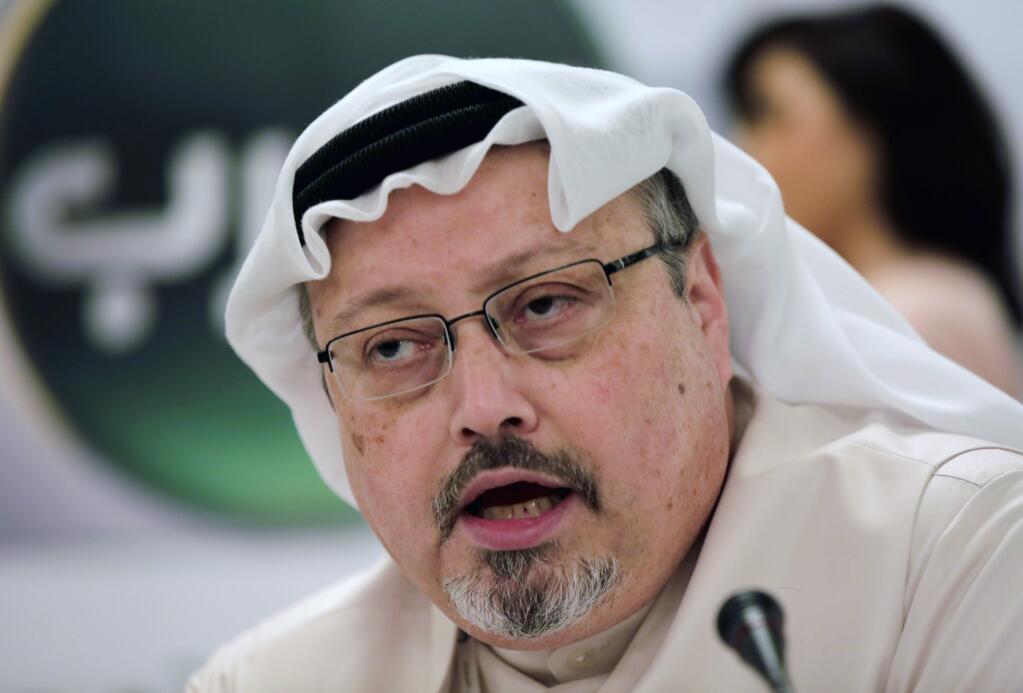 FILE - In this Feb. 1, 2015, file photo, Saudi journalist Jamal Khashoggi speaks during a press conference in Manama, Bahrain. Turkish claims that Khashoggi, who wrote for The Washington Post, was slain inside a Saudi diplomatic mission in Turkey, has put the Trump administration in a delicate spot with one of its closest Mid-east allies. (AP Photo/Hasan Jamali, File)