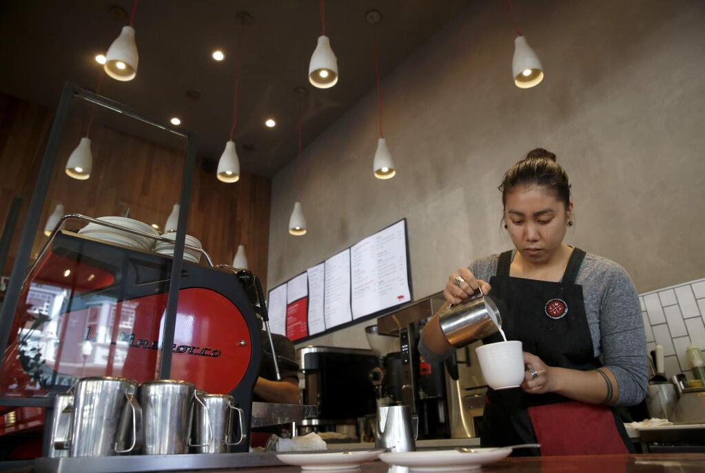 Barista Cheryl Barraca makes drinks at Equator Coffee and Teas on Wednesday, March 30, 2016 in Mill Valley, California . (BETH SCHLANKER/ The Press Democrat)