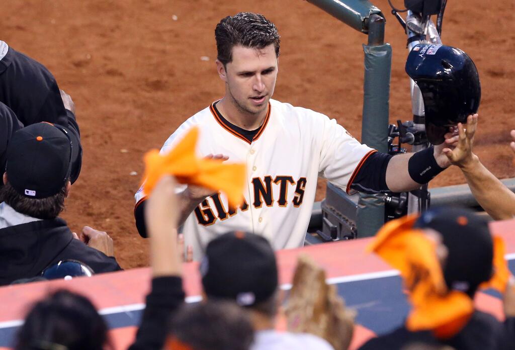 Catcher Buster Posey is having a stellar season for the Giants and is threating to win a batting title. But he's a clean-up hitter who's hitting a mere .255 with one home run with runners in scoring position. (Christopher Chung / The Press Democrat)