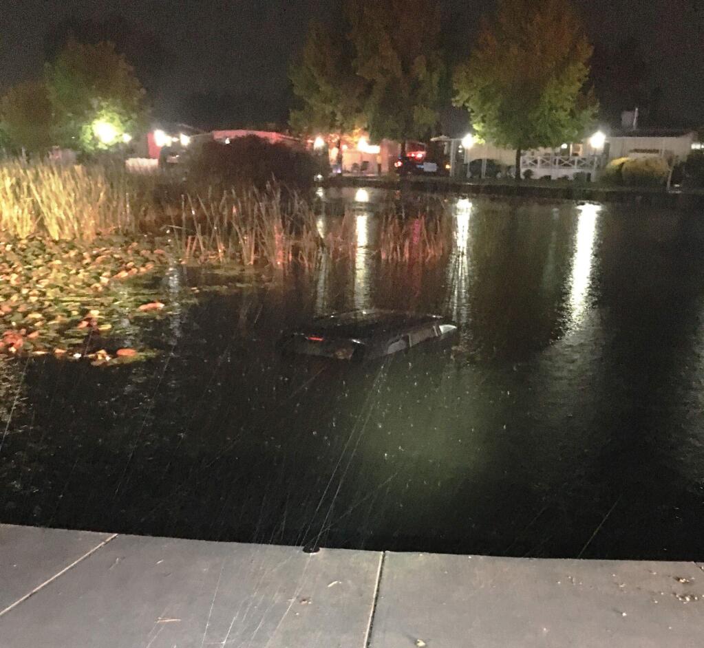 Police officers leaped into a pond Saturday night in Rohnert Park, rescuing a 59-year-old woman and her two young granddaughters from a submerged SUV. (ROHNERT PARK POLICE)