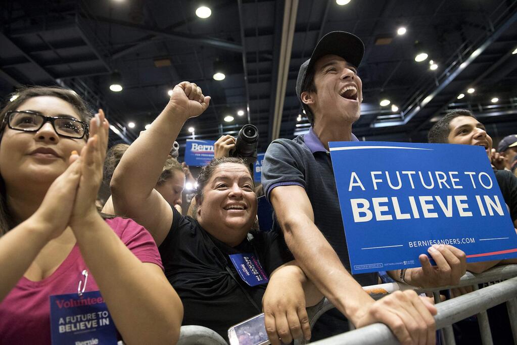 Supporters cheer as Democratic presidential candidate Sen. Bernie Sanders speaks to a crowd of supporters at Modesto Centre Plaza in Modesto, Calif., on Thursday, June, 2, 2016. (Andy Alfaro/The Modesto Bee via AP)