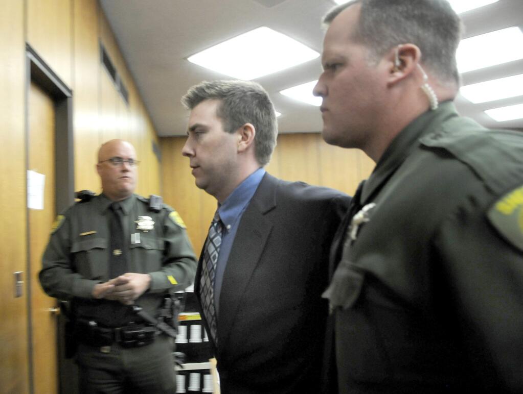 FILE - In this June 2, 2010 file photo, James Biela is led from the courtroom in Reno, Nev. A jury sentenced Biela to death for raping and killing a college coed after sexually assaulting two others in a string of attacks that had the city of Reno on edge for most of 2008. A lawyer for Biela goes before a Washoe County judge next week in the latest attempt to overturn his convictions. (AP Photo/Marilyn Newton, Pool, File)