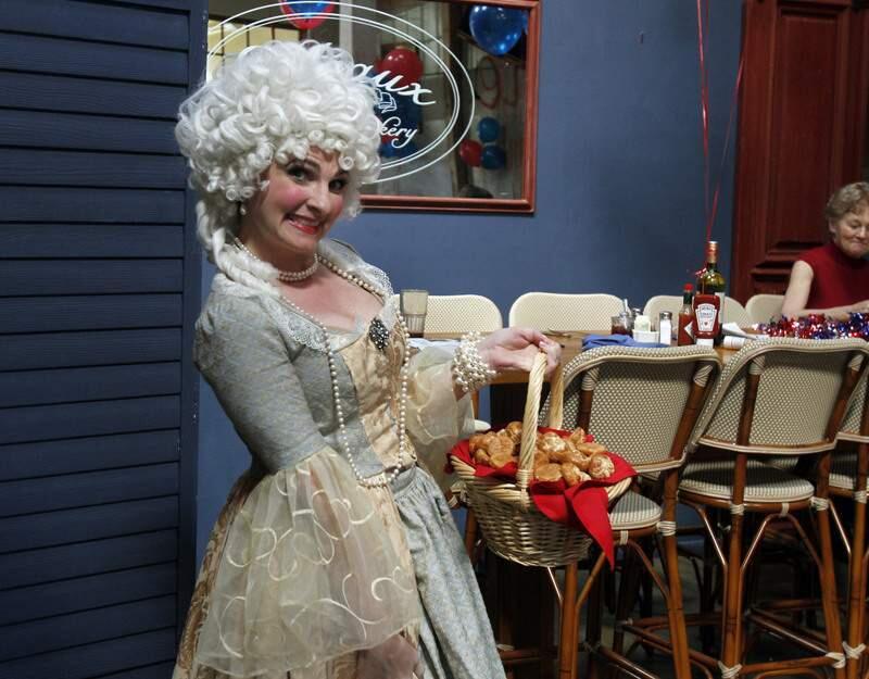 Marie Antoinette hands out pastries at Costeaux Bakery's 2011 Bastille Day celebration in Healdsburg.(PD File, 2011)