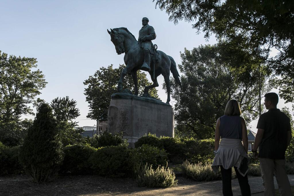 A statue of Confederate Gen. Robert E. Lee, whose planned removal fueled a rally of white nationalists in Charlottesville, Virginia last weekend . The violence it sparked highlights the growing divide between American citizens. (EDU BAYER / New York Times)