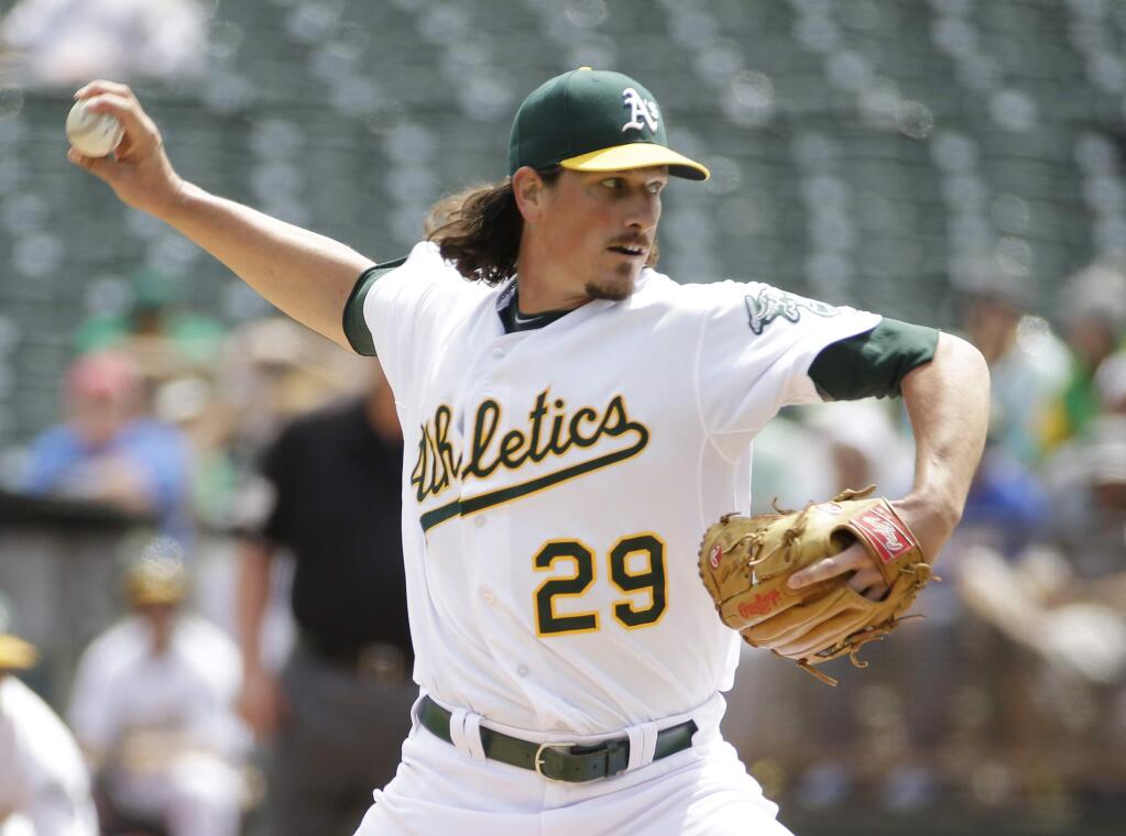 Oakland Athletics starting pitcher Jeff Samardzija throws in the first inning of their interleague baseball game against the New York Mets Wednesday, Aug. 20, 2014, in Oakland, Calif. (AP Photo/Eric Risberg)