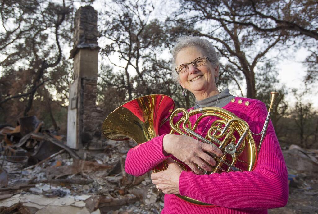 In front of her home that was totally destroyed during the recent valley fires is Sonoma's newest 'Treasure,' Barbara McElroy. A talented musician herself, she taught music to many generations of young Sonomans. (Photo by Robbi Pengelly/Index-Tribune)