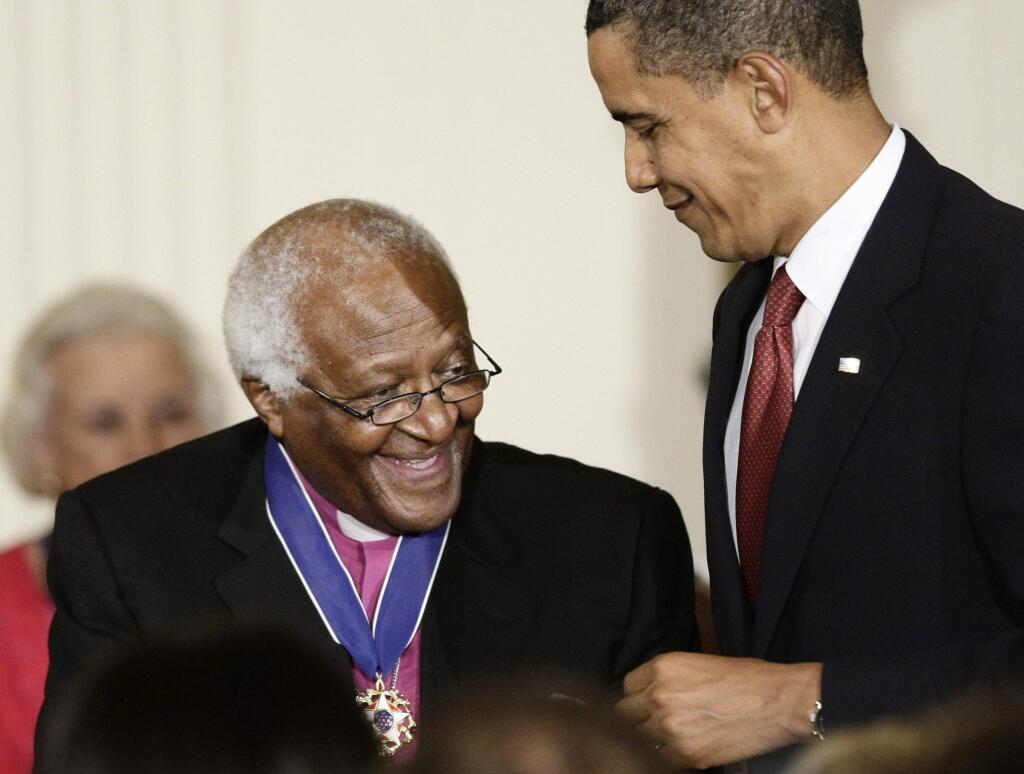 President Barack Obama presents a 2009 Presidential Medal of Freedom to Desmond Tutu, widely regarded as 'South Africa’s moral conscience,' who was a leading anti-apartheid activist in South Africa., Wednesday, Aug. 12, 2009, in the East Room of the White House in Washington. (AP Photo/J. Scott Applewhite)