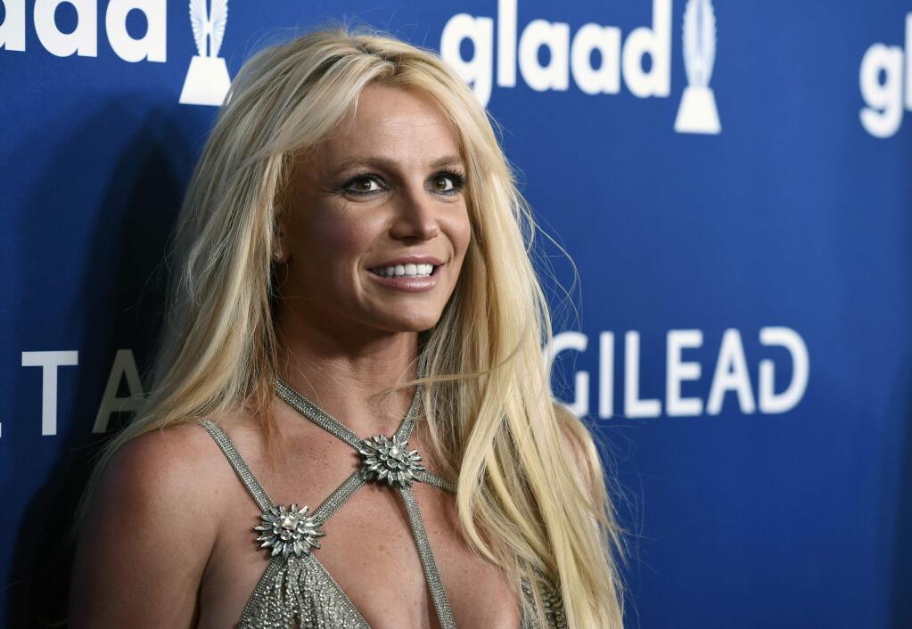 FILE - This April 12, 2018 file photo shows Britney Spears at the 29th annual GLAAD Media Awards in Beverly Hills, Calif. Though Black Out Tuesday was originally organized by the music community, the social media world went dark on Tuesday in support of the Black Lives Matter movement and the many killings of black people around the world that has caused outrage and protests. 'I won't be posting on social media and I ask you all to do the same,' Britney Spears tweeted. 'We should use the time away from our devices to focus on what we can do to make the world a better place …. for ALL of us !!!!!' (Photo by Chris Pizzello/Invision/AP, File)