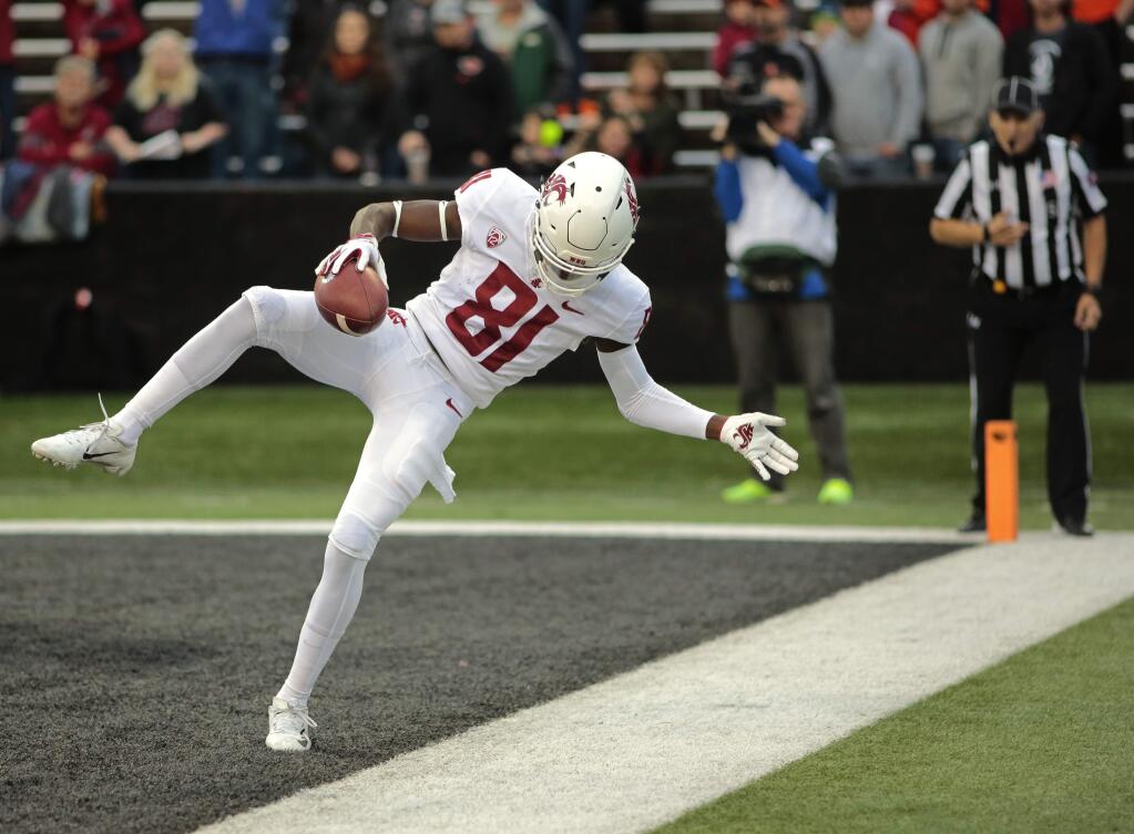 Washington State's Renard Bell gets one foot down in the end zone for a touchdown catch in the first half against Oregon State in Corvallis, Ore., Saturday, Oct. 6, 2018. (AP Photo/Timothy J. Gonzalez)