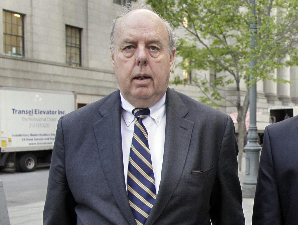 FILE - In this April 29, 20111, file photo, attorney John Dowd walks in New York. Dowd, President Donald Trump's lead lawyer in the Russia investigation has left the legal team, is confirming his decision in an email to The Associated Press. Dowd says he 'loves the president' and wishes him well. (AP Photo/Richard Drew, File)