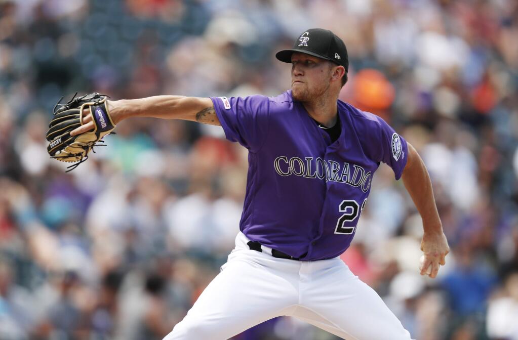 Colorado Rockies starting pitcher Kyle Freeland works against the San Francisco Giants in the first inning of a baseball game Sunday, Aug. 4, 2019, in Denver. (AP Photo/David Zalubowski)
