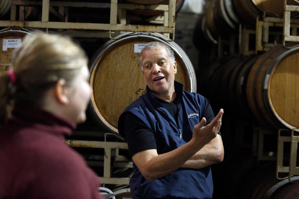 Esterlina Vineyards and Winery co-owner and vineyard manager Chris Sterling, right, whose family is one of the few local African-American winemakers, talks with winemaker Isabelle Mort in the winery's barrel room in Healdsburg, California on Wednesday, February 17, 2016. (Alvin Jornada / The Press Democrat)