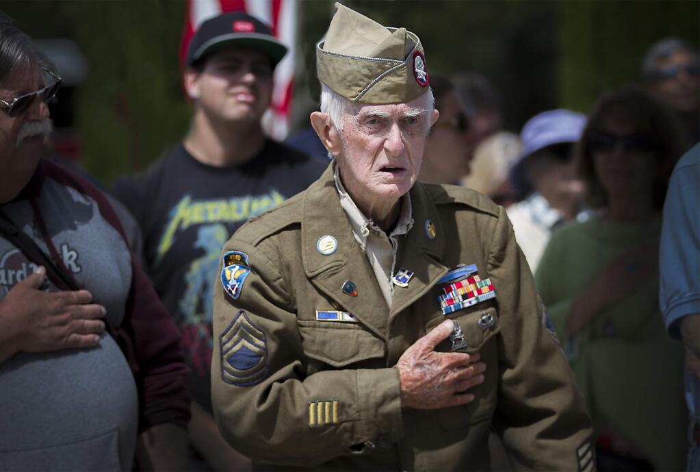 Donald Clouston, who served in both World War II and the Korean War, during the Pledge of Allegiance. The annual Sonoma Valley Memorial Day observance took place at the Sonoma Veterans Memorial Park on Monday, May 29. (Photo by Robbi Pengelly/Index-Tribune)