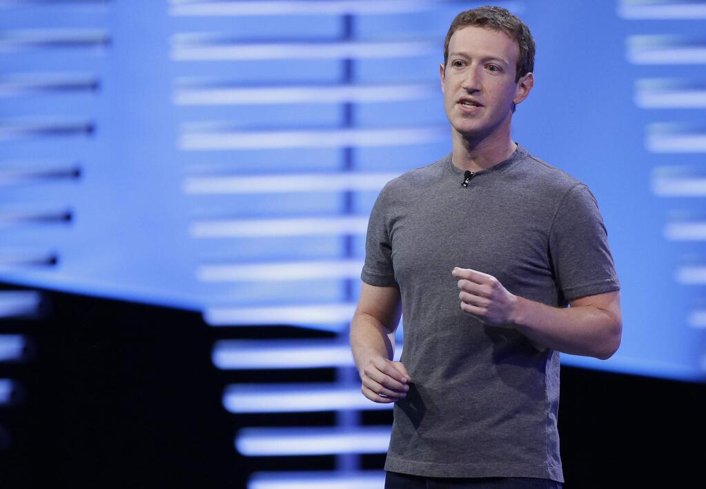 FILE - In this April 12, 2016, file photo, Facebook CEO Mark Zuckerberg speaks during the keynote address at the F8 Facebook Developer Conference in San Francisco. Facebook has unwittingly allowed groups backed by the Russian government to target users with ads. That‚Äôs after it took months to acknowledge its outsized role in influencing the U.S. election by allowing for the spread of fake news. Now it is under siege, facing questions from lawmakers and others seeking to rein in its enormous power and demand more transparency. (AP Photo/Eric Risberg, File)