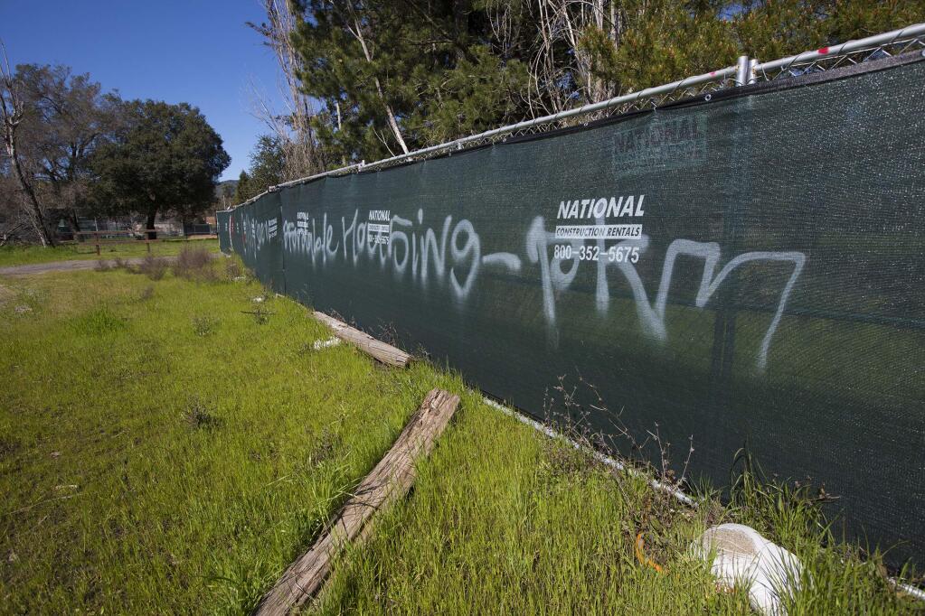 Graffiti on the fenced barrier at the former Paul's Resort property in Boyes Hot Springs.(Photo by Robbi Pengelly/Index-Tribune)
