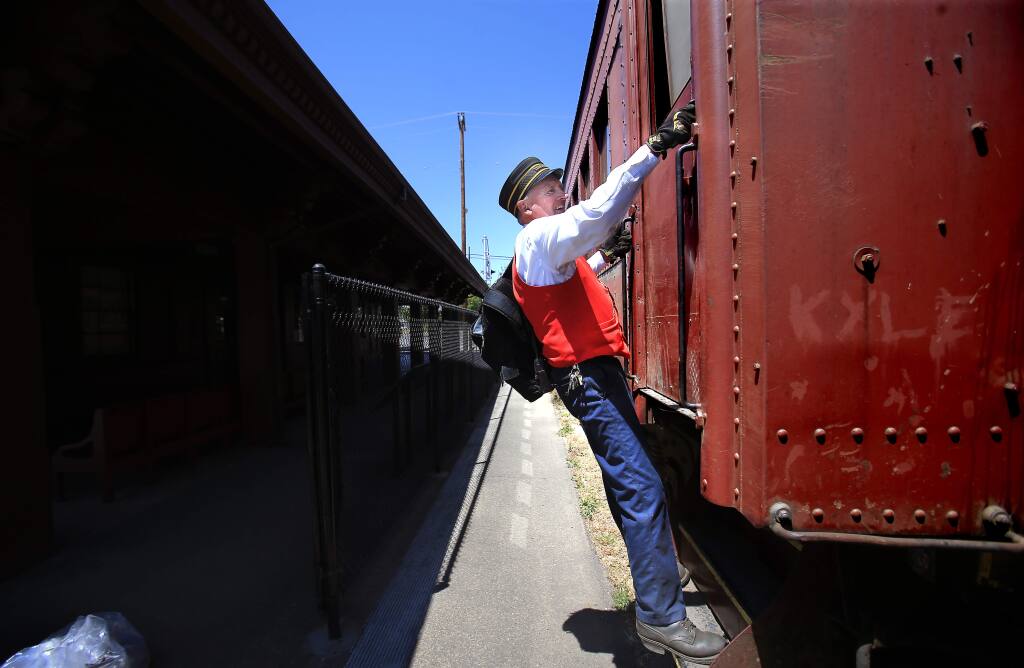 Skunk Train conductor Glen Ford locks up at the Willits depot after a day of riding the rails on Thursday, July 2, 2015. (KENT PORTER/ PD)