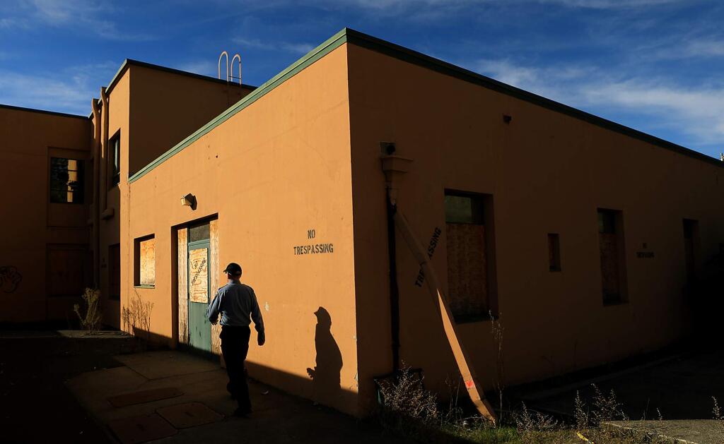 Edward Gross of First Security Services of Santa Rosa makes his rounds at the old and boarded up Sutter/Community Hospital on Chanate Road, Tuesday, Dec. 11, 2018 in Santa Rosa. (Kent Porter / The Press Democrat) 2018