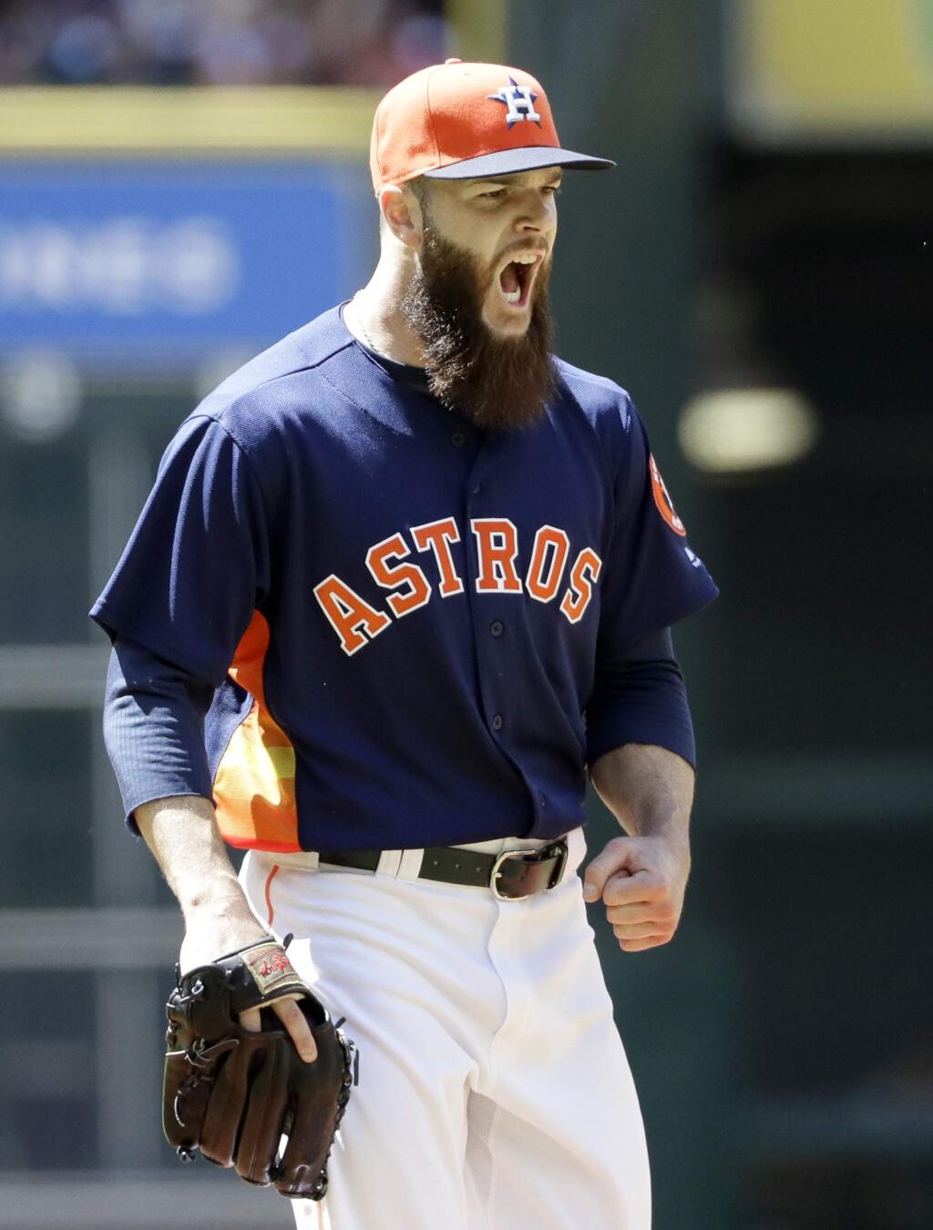 Houston Astros starting pitcher Dallas Keuchel yells after striking out Oakland Athletics' Chad Pinder in the seventh inning of a baseball game Sunday, April 30, 2017, in Houston. (AP Photo/David J. Phillip)