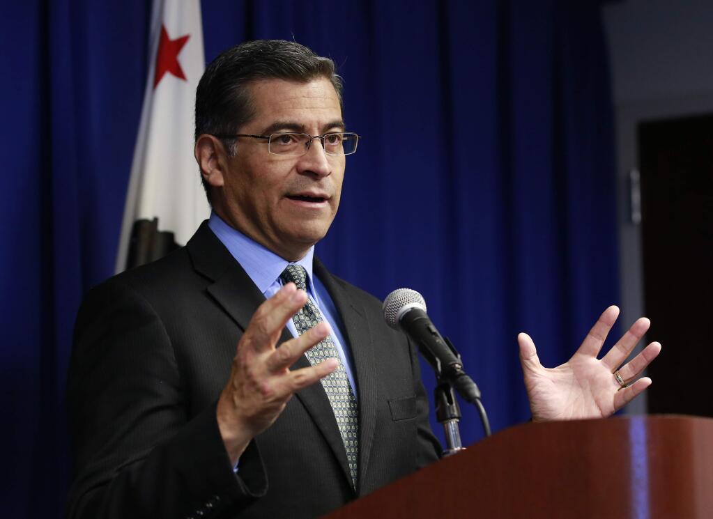 California Attorney General Xavier Becerra discusses the need for bail reform, Tuesday, Feb. 20, 2018, in Sacramento, Calif. Becerra said judges must consider suspects' ability to pay when they set bail amounts, adding momentum to ongoing talks aimed at finding a better way to make sure suspects show up in court. (AP Photo/Rich Pedroncelli)