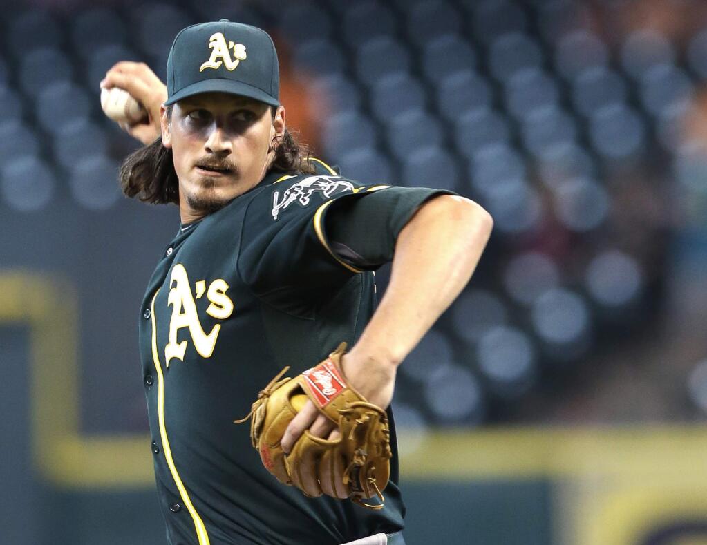 Oakland Athletics' Jeff Samardzija delivers a pitch against the Houston Astros in the first inning of a baseball game Monday, Aug. 25, 2014, in Houston. (AP Photo/Pat Sullivan)