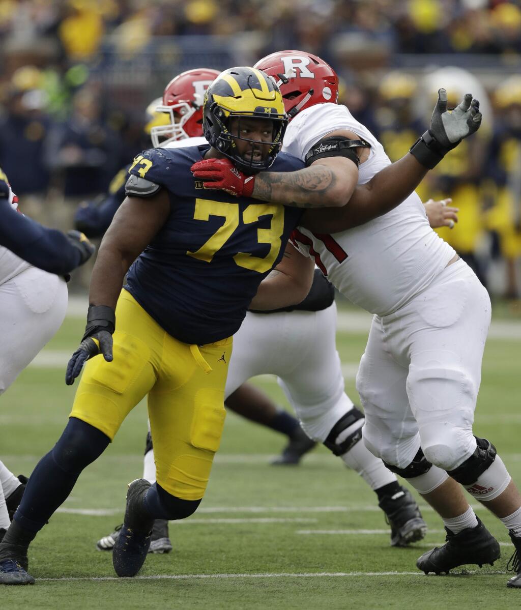 Michigan defensive lineman Maurice Hurst, left, goes up against Rutgers offensive lineman Marcus Applefield during the second half, Saturday, Oct. 28, 2017, in Ann Arbor, Mich. (AP Photo/Carlos Osorio)