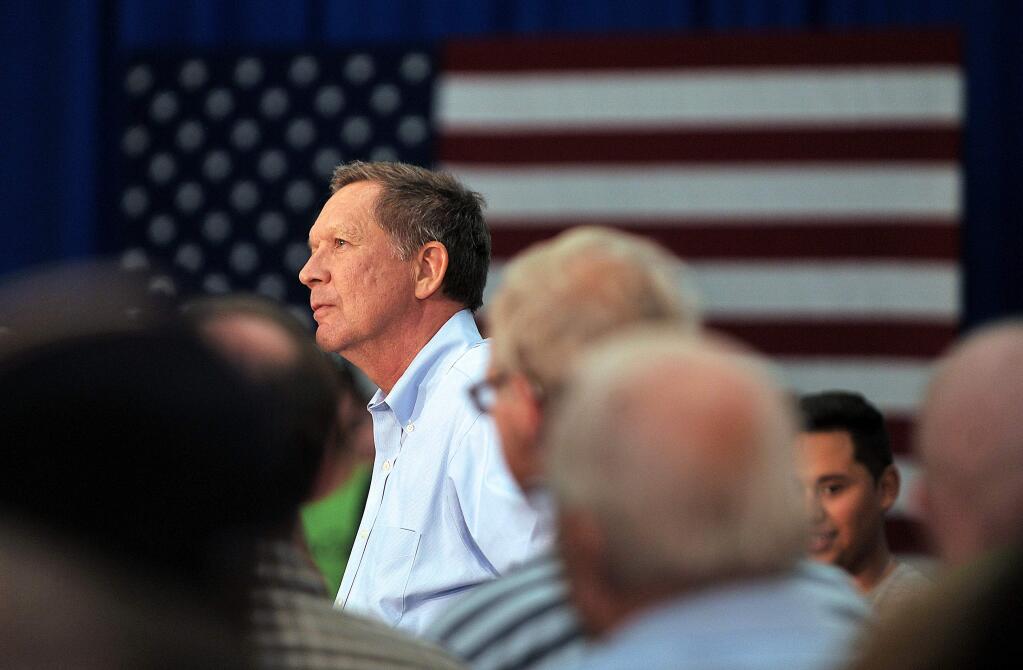 Republican presidential candidate John Kasich arrives to Central Medford High School in Medford, Ore. on Thursday, April 28, 2016. (Jamie Lusch/The Medford Mail Tribune via AP)