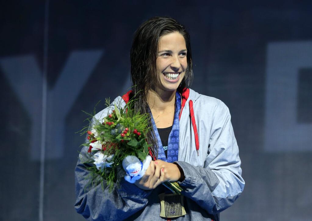 Maya DiRado celebrates after winning the women's 400-meter individual medley at the U.S. Olympic swimming trials in Omaha, Neb., Sunday, June 26, 2016. (AP Photo/Orlin Wagner)