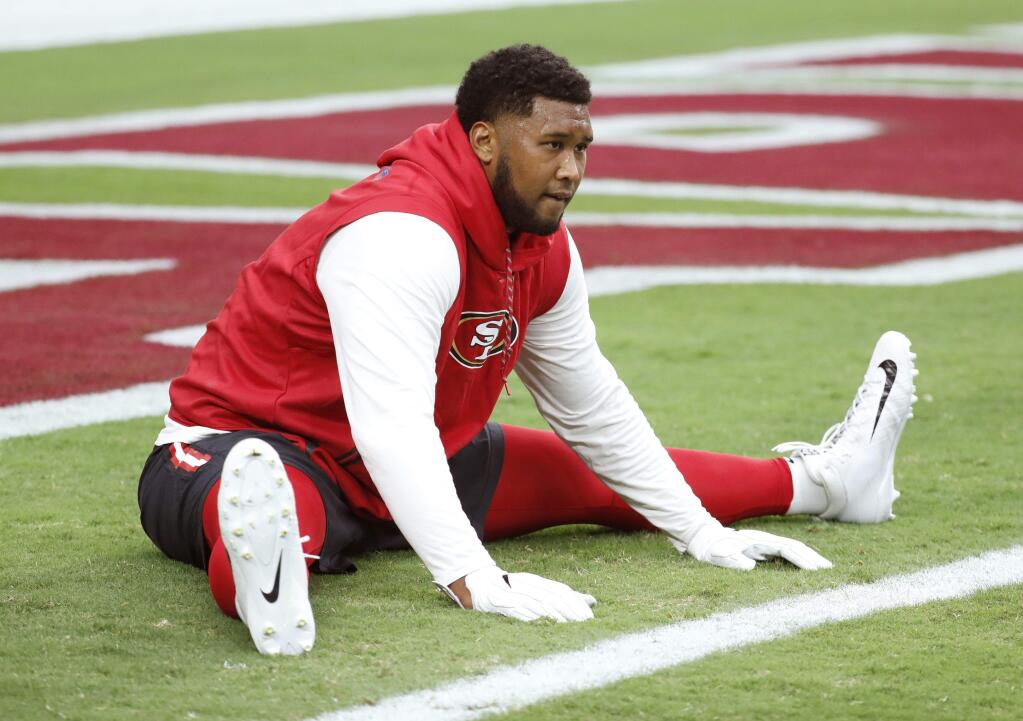 San Francisco 49ers defensive tackle DeForest Buckner stretches prior to a game against the Arizona Cardinals, Sunday, Oct. 1, 2017, in Glendale, Ariz. (AP Photo/Rick Scuteri)