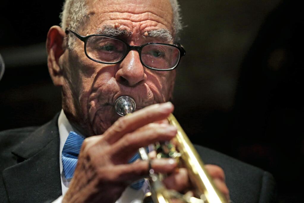 Dixieland jazz musician Lionel Ferbos performs at his 102nd birthday party at the Palm Court Jazz Cafe in New Orleans. Lionel Ferbos died Saturday, July 19, 2014, at his home in New Orleans, according to a family friend. He was 103. (AP Photo/Gerald Herbert)