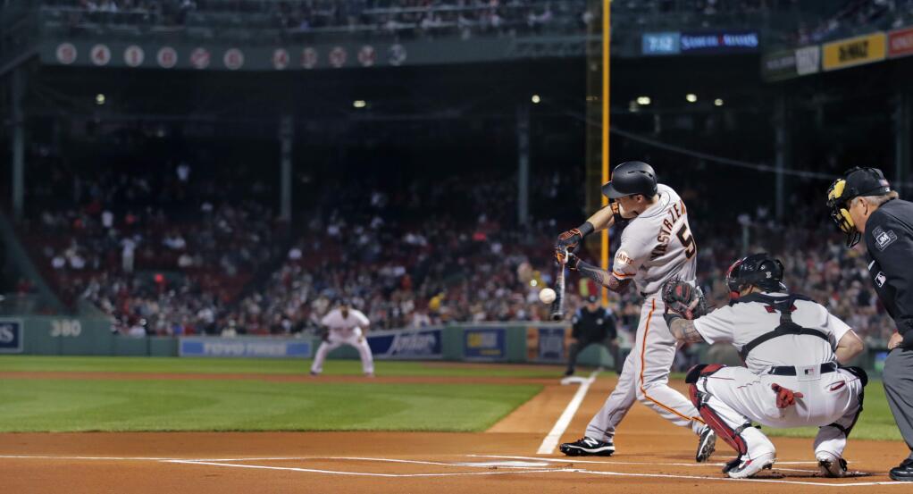 San Francisco Giants' Mike Yastrzemski (5) takes a swing as the lead off batter in a baseball game against the Boston Red Sox at Fenway Park in Boston, Tuesday, Sept. 17, 2019. Yastrzemski is the grandson of Red Sox great and Hall of Famer Carl Yastrzemski. Yastrzemski struck out in his plate appearance. (AP Photo/Charles Krupa)
