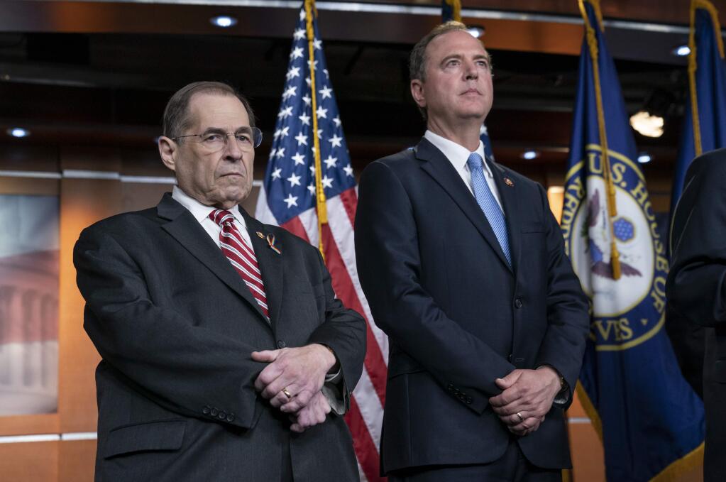 House Judiciary Committee Chairman Jerrold Nadler, D-N.Y., left, and House Intelligence Committee Chairman Adam B. Schiff, D-Calif., pause before taking questions from reporters after passage of a resolution to take legal action against President Donald Trump's administration and potential witnesses, a response to those who defy subpoenas in Congress' Russia probe and other investigations, on Capitol Hill in Washington, Tuesday, June 11, 2019. (AP Photo/J. Scott Applewhite)