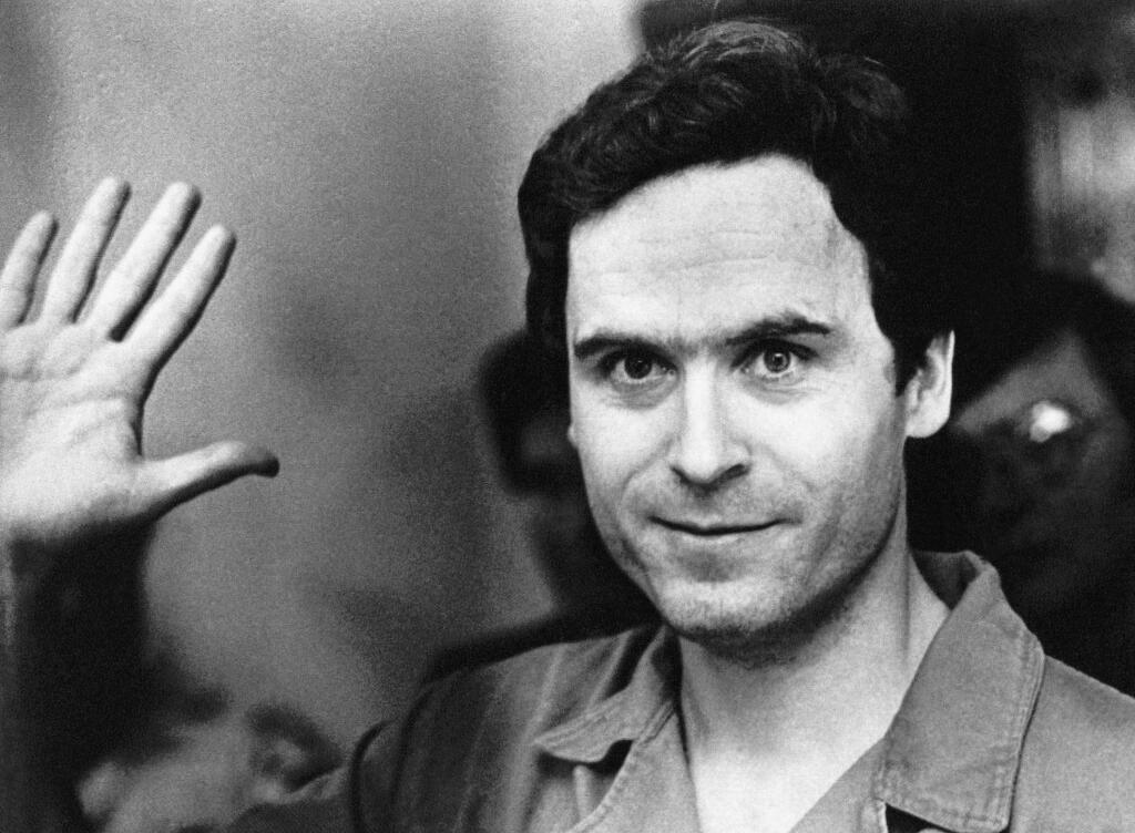 FILE - In this July 28, 1978, file pool photo, Ted Bundy mugs for the media after being informed of his indictment by a grand jury in Tallahassee, Fla. The Hollywood Reporter and Variety reported on May 16, 2017, that Zac Efron will play Bundy in an upcoming biopic about the serial killer. (Pool Photo via AP, File)