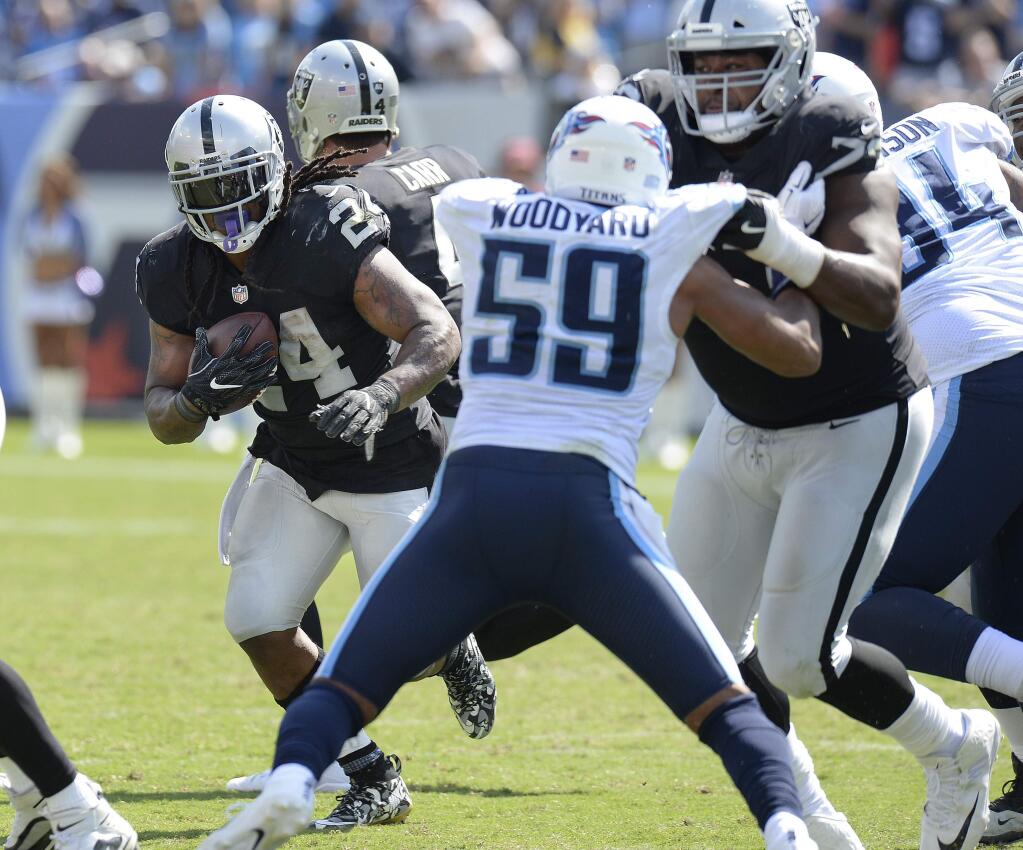 Oakland Raiders running back Marshawn Lynch (24) runs the ball as Tennessee Titans inside linebacker Wesley Woodyard (59) is blocked by Marshall Newhouse (73) in the fourth quarter Sunday, Sept. 10, 2017, in Nashville, Tenn. The Raiders won 26-16. (AP Photo/Mark Zaleski)
