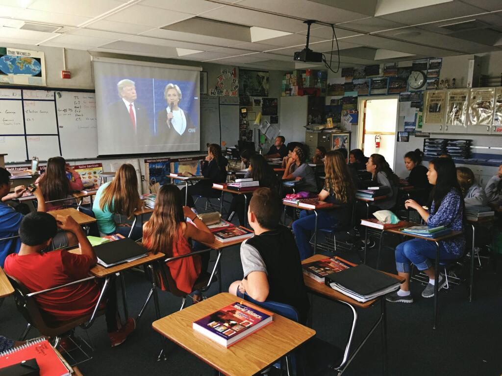 Students in one of Ian Myers' world and U.S. history classes at Rincon Valley Middle School discuss Monday the town hall debate from the previous night between presidential candidates Donald Trump and Hillary Clinton. Photo/Christi Warren