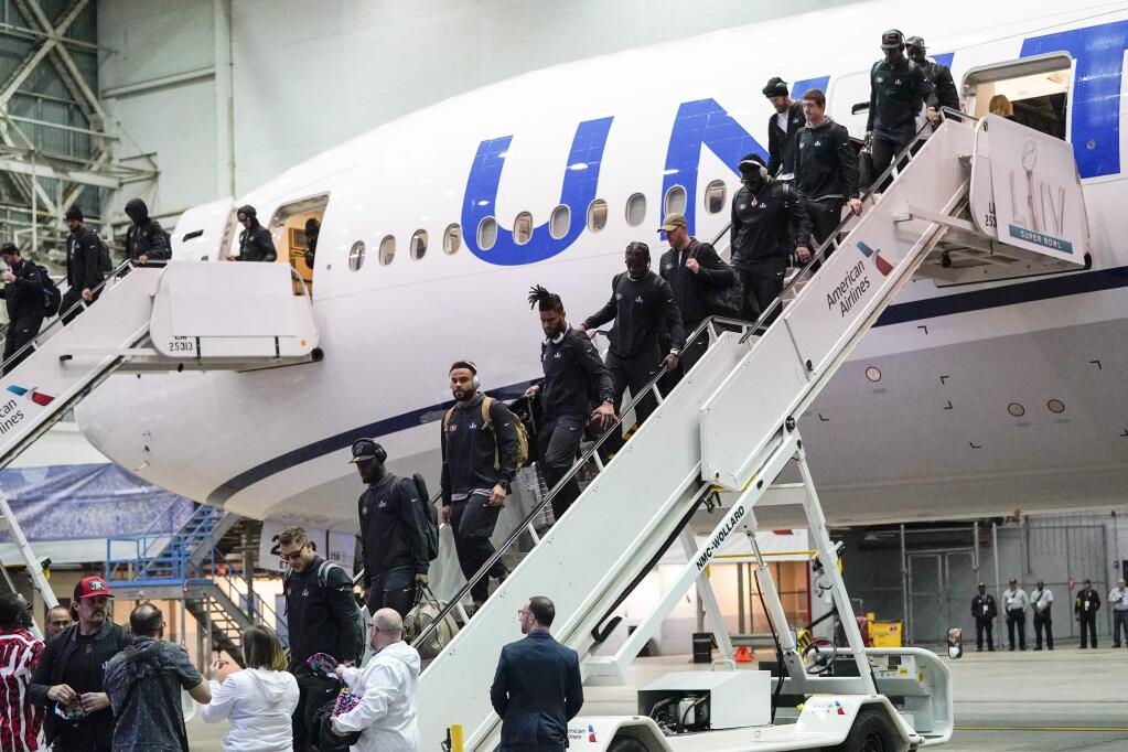 The San Francisco 49ers arrive for the NFL Super Bowl 54 football game Sunday, Jan. 26, 2020, at the Miami International Airport in Miami. (AP Photo/David J. Phillip)