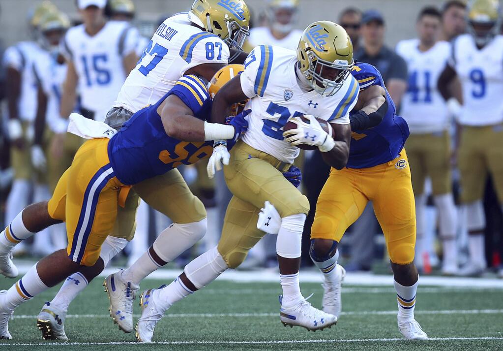 UCLA's Joshua Kelley (27) rushes against Cal during the first half Saturday, Oct. 13, 2018, in Berkeley. (AP Photo/Ben Margot)