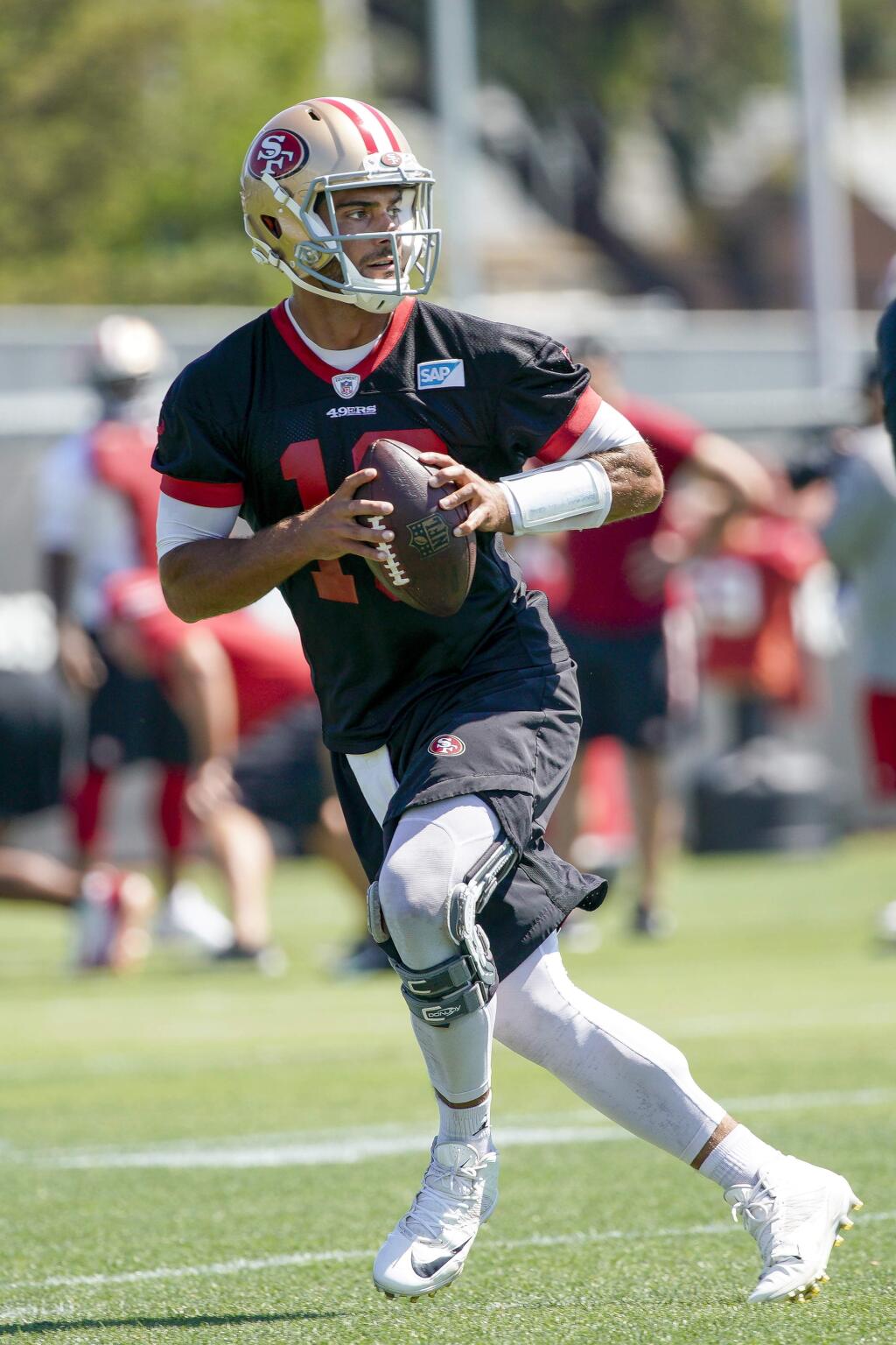 San Francisco 49ers quarterback Jimmy Garoppolo drops back as he runs a drill at the team's training facility in Santa Clara, Tuesday, June 11, 2019. (AP Photo/Tony Avelar)