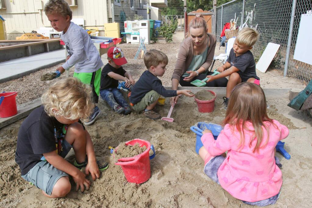 Teacher Jen Copeland works with children at the North Bay Children's Center preschool Cherry Valley campus in Petaluma on Tuesday, August 18, 2015. (SCOTT MANCHESTER/ARGUS-COURIER STAFF)