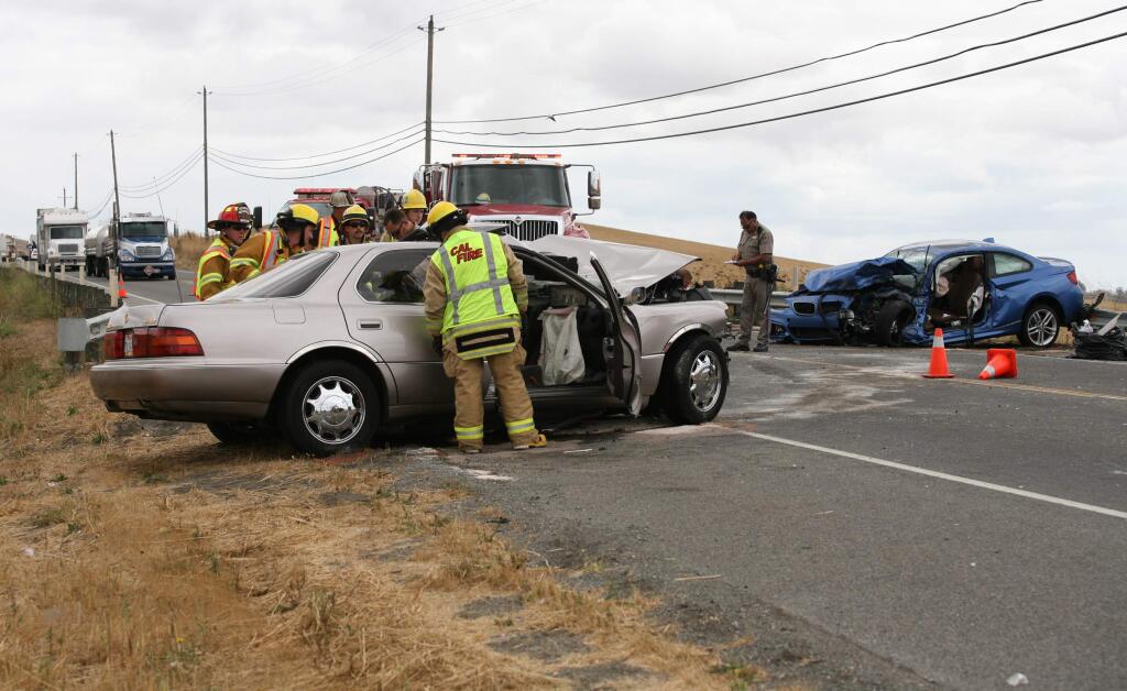 A two car fatal accident that occurred on Lakeville Hwy near Browns Lane south of Petaluma at about 11:44 am on Thursday, September 18, 2014. Cause of the accident thought to be the gold car, left, drifted over the center line into the path of the blue car. The driver of the gold car was deceased at the scene. (SCOTT MANCHESTER/ARGUS-COURIER STAFF)