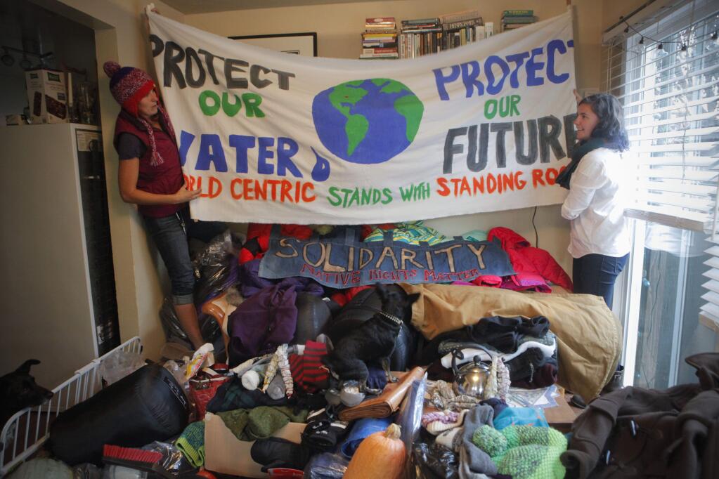 On Tuesday, November 22, 2016, Anna Dow, 32, (left) and Lauren Fuhry, 30 (right) packed supplies that they brought to Standing Rock where protesters are taking a stand against the proposed Dakota Access Pipeline through Native American land. They drove to North Dakota in a camper van packed with coats, sleeping bags, and donations. (CRISSY PASCUAL/ARGUS-COURIER STAFF)