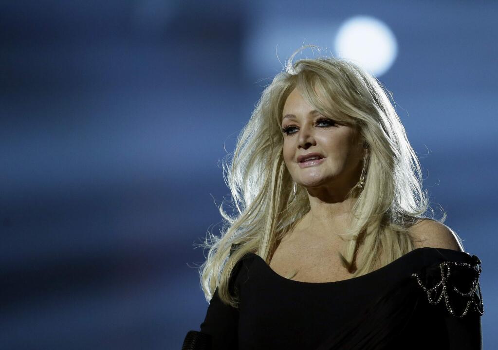 FILE - In this May 17, 2013, file photo, Bonnie Tyler performs her song 'Believe in Me' during a rehearsal for the final of the Eurovision Song Contest at the Malmo Arena in Malmo, Sweden. Royal Caribbean announced on Aug. 16, 2017, that Tyler will perform her hit “Total Eclipse of the Heart” at sea on the day of the total eclipse Monday during a 'Total Eclipse Cruise.' (AP Photo/Alastair Grant, File)