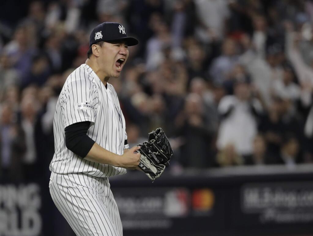New York Yankees starting pitcher Masahiro Tanaka reacts after striking out Houston Astros' Josh Reddick during the fifth inning of Game 5 of baseball's American League Championship Series Wednesday, Oct. 18, 2017, in New York. (AP Photo/David J. Phillip)