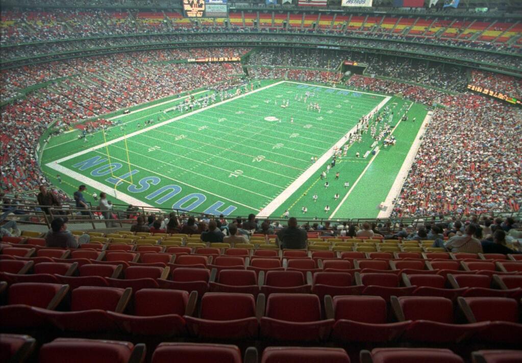In this Nov. 12, 1995, file photo. nearly half the seats were empty in Houston's Astrodome as the Houston Oilers played the Cincinnati Bengals. (AP Photo/Michael Stravato, File)
