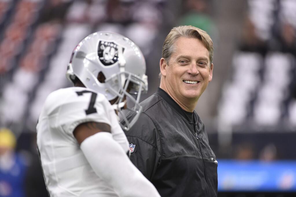 In this Saturday, Jan. 7, 2017, file photo, Oakland Raiders coach Jack Del Rio walks on the field before the first half of an AFC wild-card game between the Houston Texans and the Raiders in Houston. The Raiders rewarded Del Rio with a new four-year contract Friday, Feb. 10, 2017, replacing the original four-year deal he received when he took the job in January 2015. (AP Photo/Eric Christian Smith, File)
